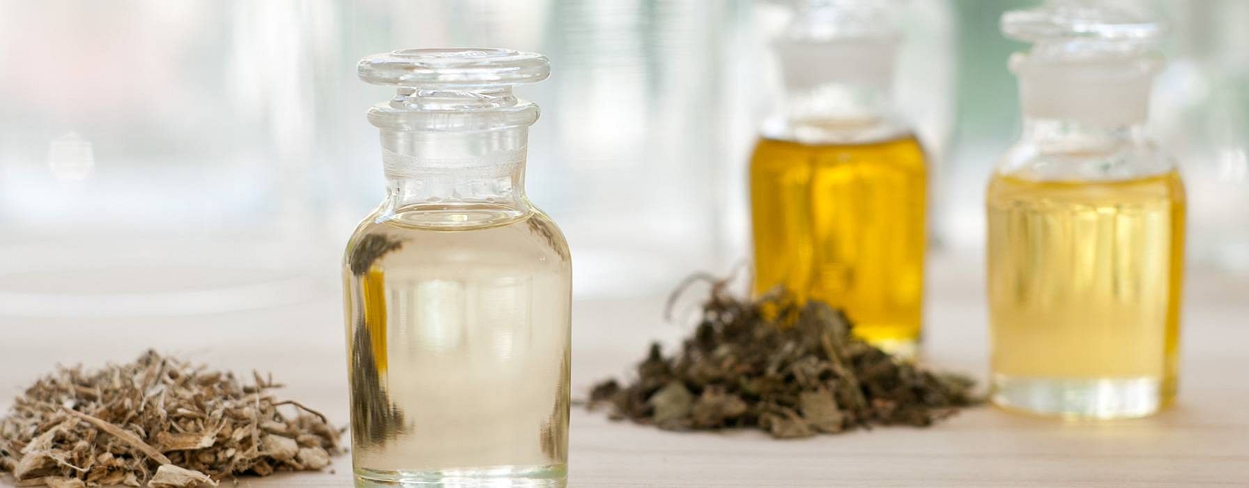 bottles oils and seeds on table