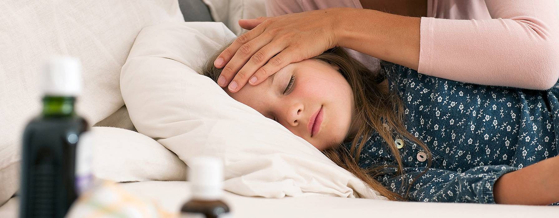 mother checking on sick child