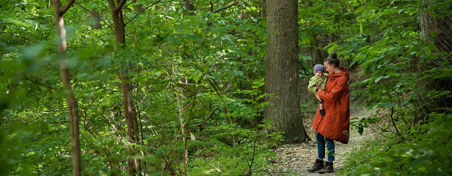 mother and baby in the woods