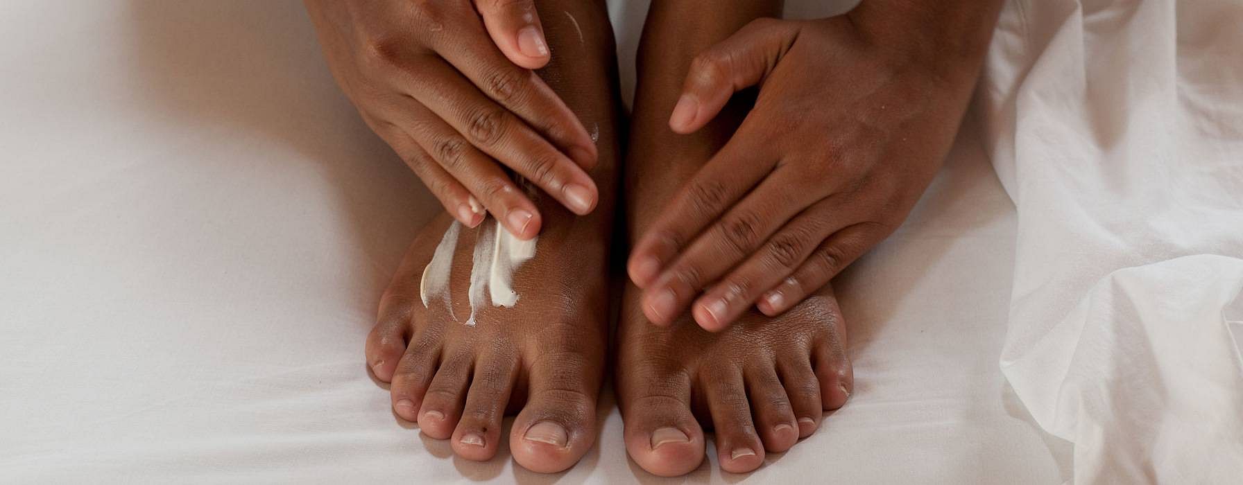 rubbing Skin Food Body butter on feet