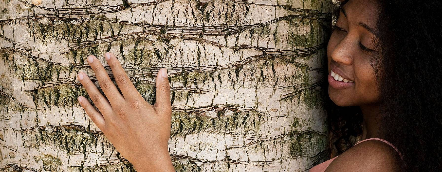 woman hugging a tree