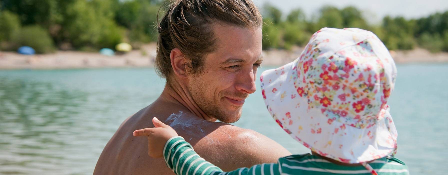 dad with baby on the beach