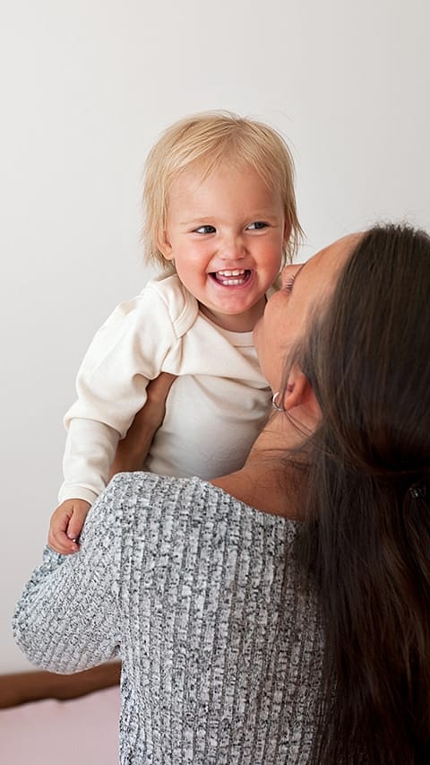 Mother and baby playing