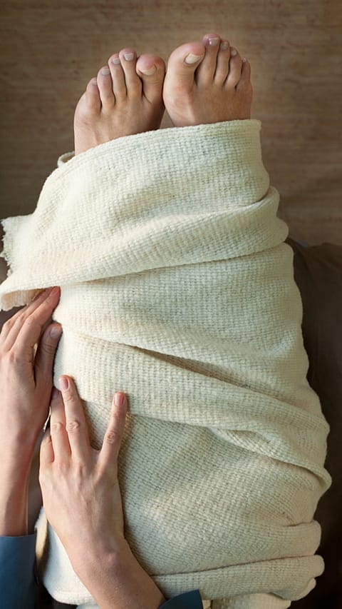 wraping feet in warm towel