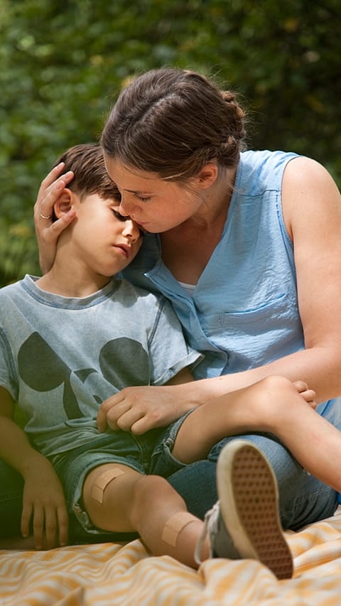 mother gives comforting cuddle