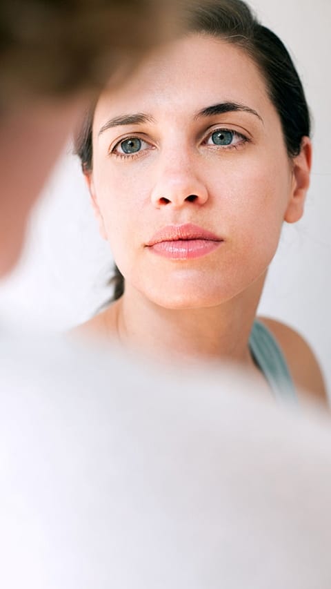 Women looking in the mirror