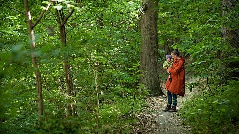 mother and baby in the woods
