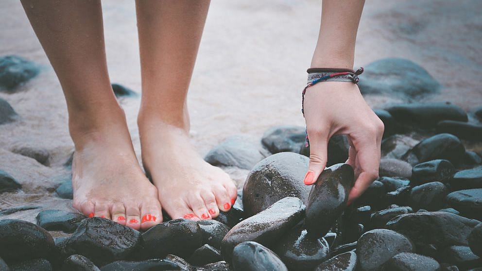 barefoot on rocks