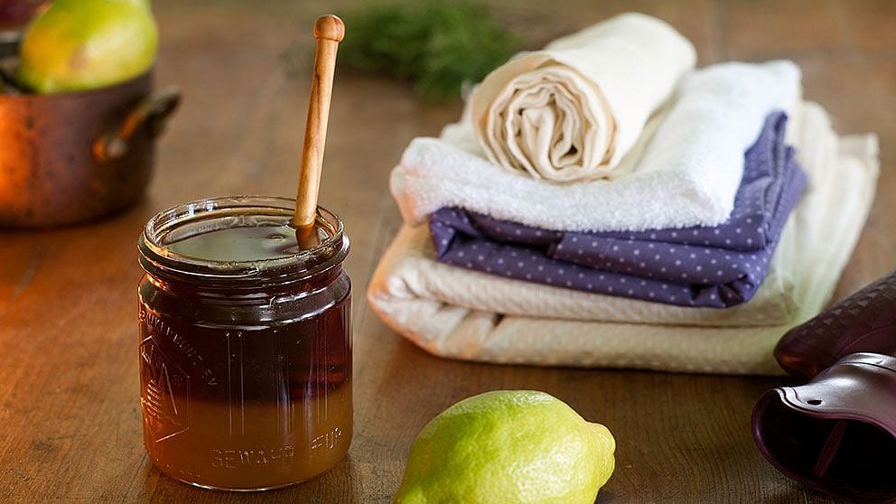 Honey and a lemon on a table