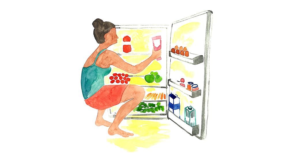 women opening fridge