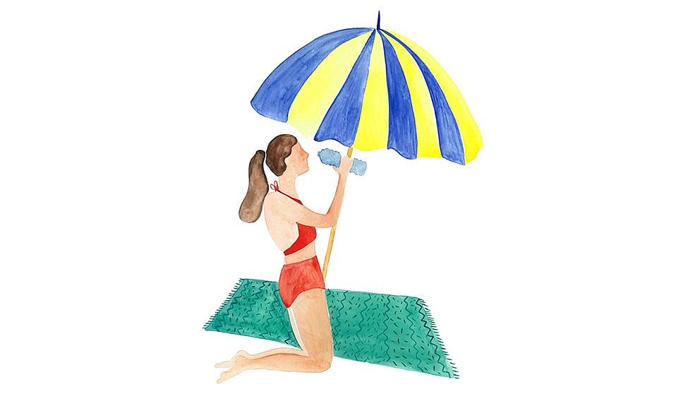 woman under a bechumbrella